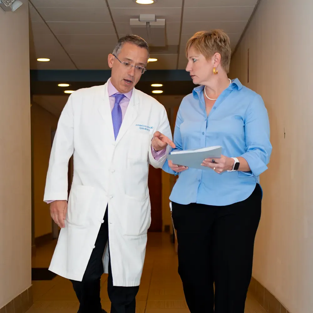 Dr. Daccache and Angela reviewing information in the practice